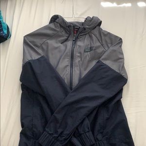 NIKE SIZE S NAVY WINDBREAKER